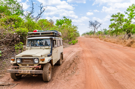 Abuja, Nigeria - March 12, 2014: 4x4 offroad vehicle on rough dirt road near the capital cityのeditorial素材