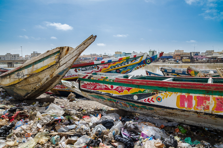 St Louis, Senegal - October 12, 2014: Colorful painted wooden fishing boats or pirogues at coast of St. Louisのeditorial素材