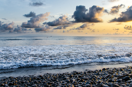 Dramatic coast with rocky volcanic beach, waves and beautiful sunset, Limbe, Cameroon.の写真素材