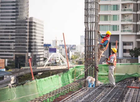 labor placing rebar at construction siteのeditorial素材