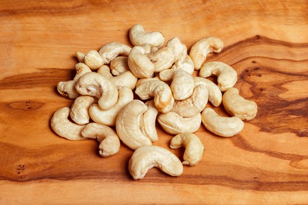 cashew nuts on wooden backgroundの写真素材