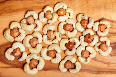cashew and hazelnut on wooden background