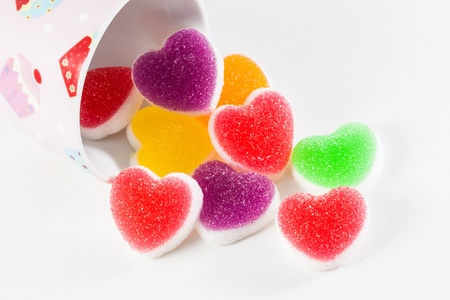 Colorful fruit jelly candy in a pink cupの写真素材
