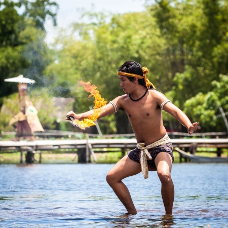 Ayutthaya, Thailand - June 19, 2010  Fire sword dance performance in the floating market in Ayutthaya province, Thailandのeditorial素材