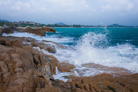 Strong wave attack the rocks in Samui island, Thailandの写真素材