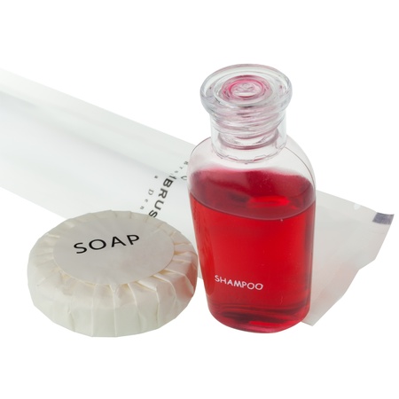 The travelling set, soap, shampoo and tooth brush against white backgroundの写真素材