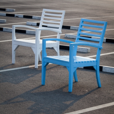 Colorful chairs were placed for decoration on the parking lotの写真素材