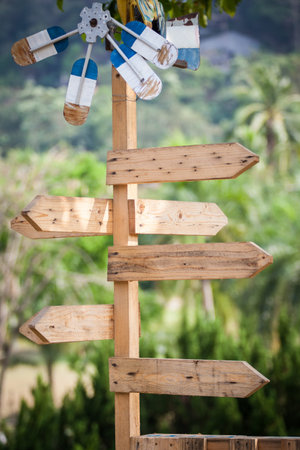 Wooden direction sign in the park
