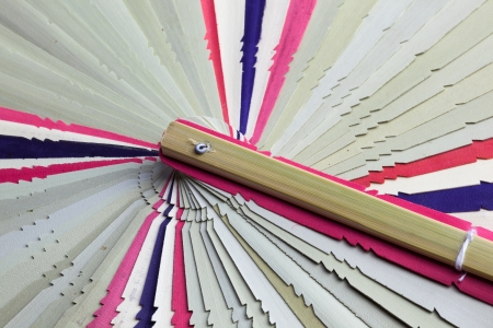 Traditiional fold fan made of dry palm leavesの写真素材