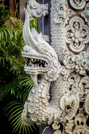 Close-up of Naga sculpture decorated in front of a temple doorの写真素材