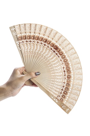 Young woman hold a fold fan in her handの写真素材