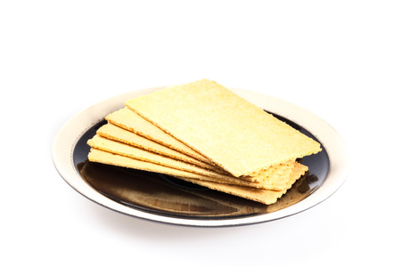Pile of butter cracker on black plateの写真素材