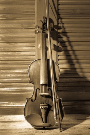 Broken violin on wooden floorの写真素材