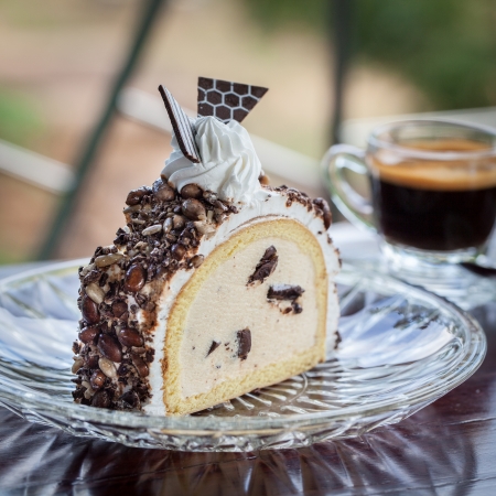 Piece of icecream cake on wood tableの写真素材