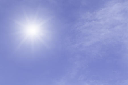 Sun light in blue sky with cloudsの写真素材