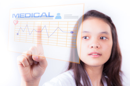 Female doctor touching a touchscreen in the hospitalの写真素材