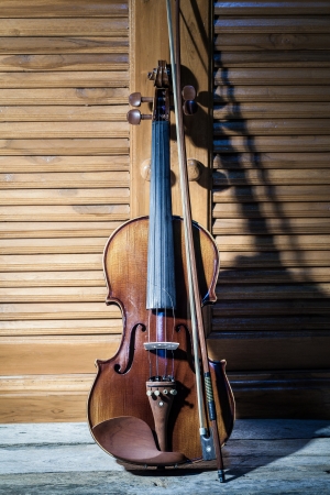 Broken violin on wooden floorの写真素材