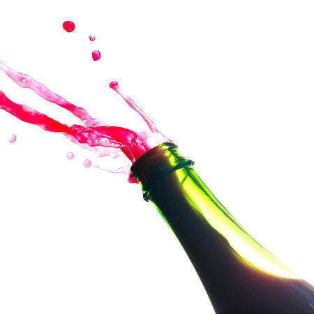 Red wine splash out from green bottleの写真素材