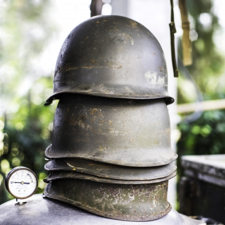 Stack of grunge military helmetsの写真素材