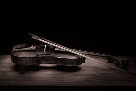 Still life with vintage violin and bowの写真素材