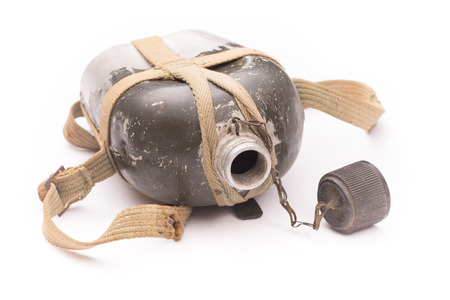 an very old aluminium flask, isolated on a white backgroundの写真素材
