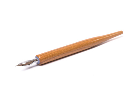 vintage dip pen on isolated white backgroundの写真素材