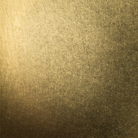 brushed metal gold plate backgroundの写真素材