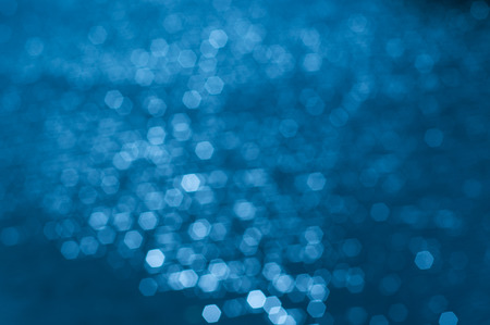 Hexagon bokeh on water surfaceの写真素材