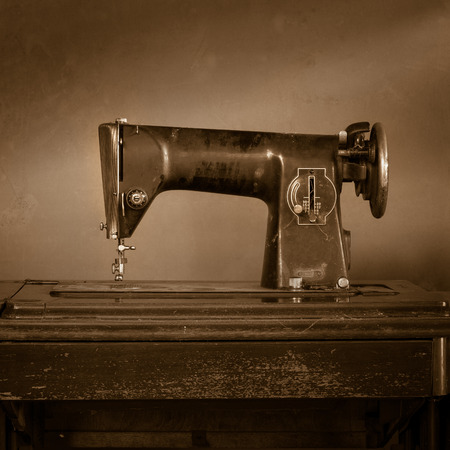 Retro sewing machine in sepia toneの写真素材