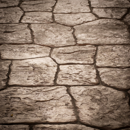 Background image of old cobblestone road backlit with low sunlightの写真素材