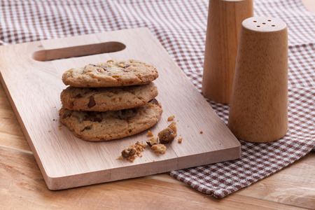 Stack of soft cookies on wooden plateの写真素材