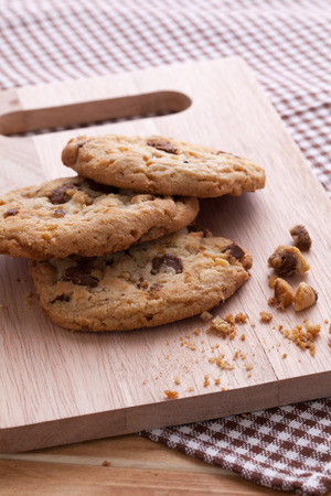 Stack of soft cookies on wooden plateの写真素材