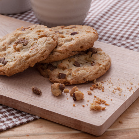 Stack of soft cookies on wooden plateの写真素材