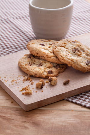 Stack of soft cookies on wooden plateの写真素材