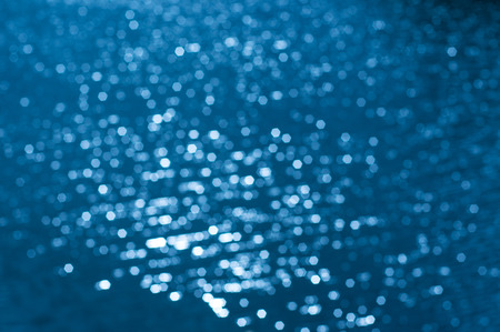 Hexagon bokeh on water surfaceの写真素材