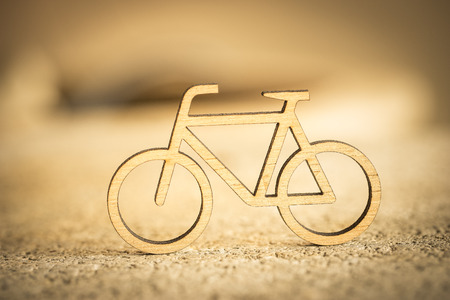 Small wooden bicycle on the road, soft focusの写真素材