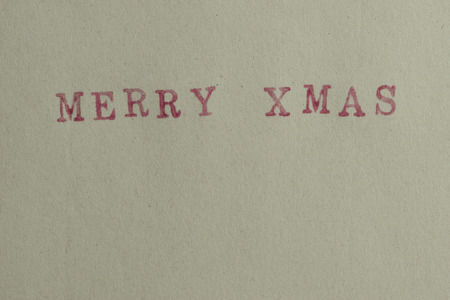 Paper texture background with word Merry Xmasの写真素材