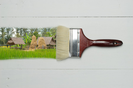 farm image from paint brush on white wooden table with spaceの写真素材