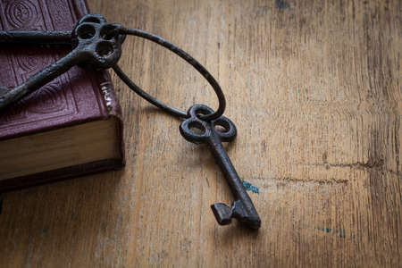 old key on a old bookの写真素材