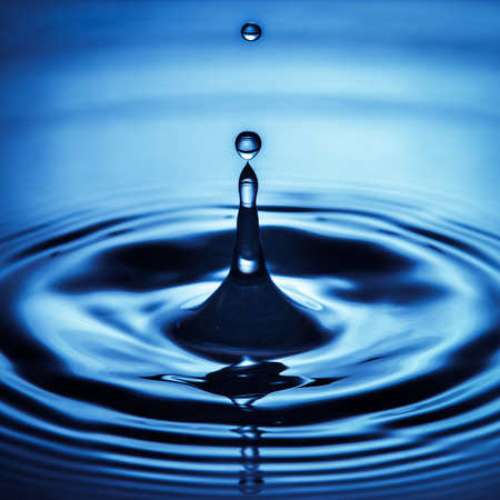 Water drop in sunlightの写真素材