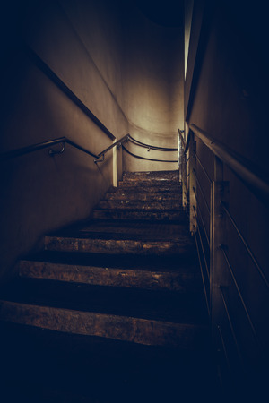 an empty stairwell with metal hand rail, vintage or retro toneの写真素材