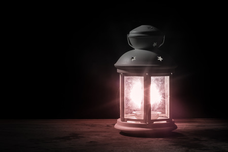 White lantern light on wooden background with copyspaceの写真素材