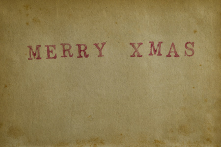 Paper texture background with word Merry Xmasの写真素材