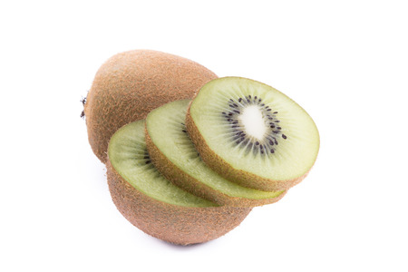 Whole kiwi fruit and his sliced segments isolated on white background cutoutの写真素材