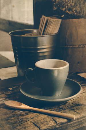 cup of coffee on the table in coffee shop vintage styleの写真素材