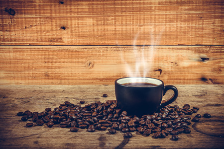 Hot coffee on wooden background, vintage styleの写真素材