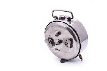 backview of alarm clock, isolated on the white background, with copyspaceの写真素材