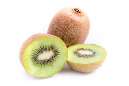 Whole kiwi fruit and his sliced segments isolated on white background cutoutの写真素材