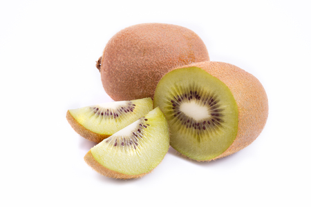Whole kiwi fruit and his sliced segments isolated on white background cutoutの写真素材