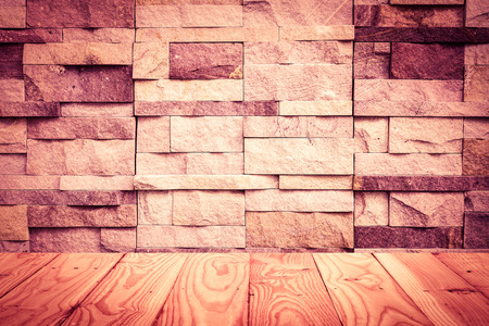 Empty top wooden shelves and stone wall background. For product displayの写真素材